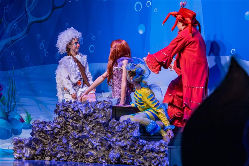 Students perform onstage